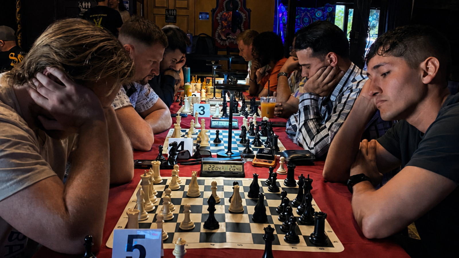 Players focused on chess games at Midnight Blitz at MCW